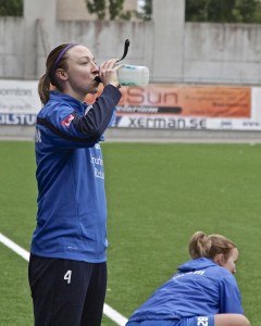 Louise Quinn downs a recovery drink at training